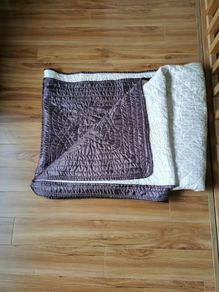 Reversible cream/brown bed throw