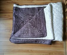 Reversible cream/brown bed throw