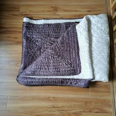 Reversible cream/brown bed throw