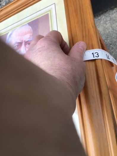 Padre Pio picture in wooden frame.