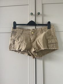 mini shorts with studded pocket and distressed hem
