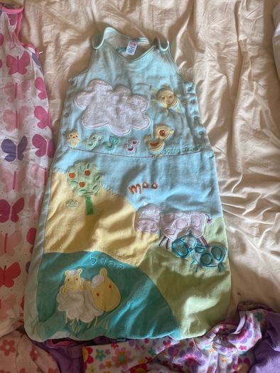 10 all in ones, 3 baby sleep bag, 4 pink blankets