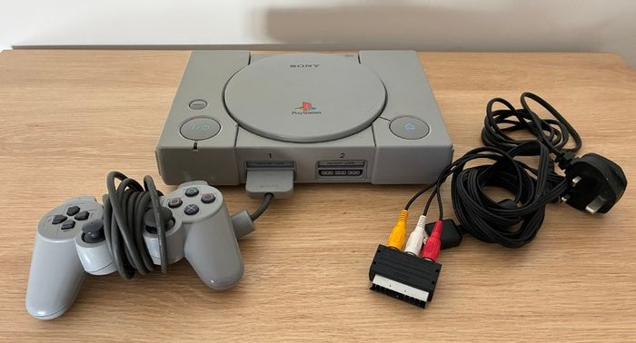 PlayStation console, Dual Shock controller, and all cables
