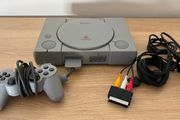 PlayStation console, Dual Shock controller, and all cables
