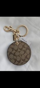 Coach mirror charm