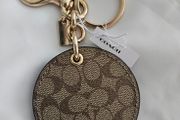 Coach mirror charm