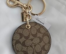 Coach mirror charm