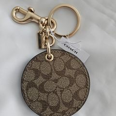 Coach mirror charm