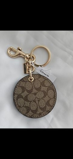 Coach mirror charm