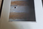 The famous NASA photograph titled "Io Moon over Jupiter"