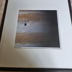 The famous NASA photograph titled "Io Moon over Jupiter"
