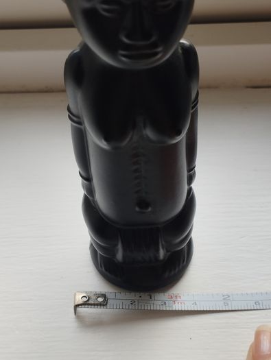 Vintage miniature "VUDU" bottle made of opaque black glass.