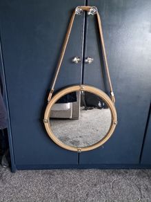 Hanging round gold mirrors