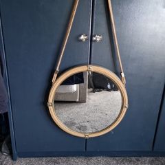 Hanging round gold mirrors