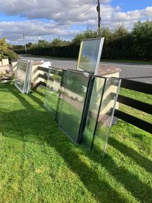 Large heavy glass panels and 2 large glass patio doors