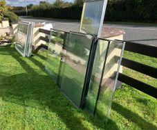 Large heavy glass panels and 2 large glass patio doors