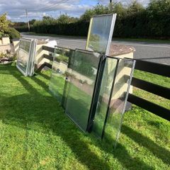 Large heavy glass panels and 2 large glass patio doors