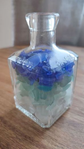 square bottle with sea glasses