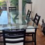 Glass and black wooden frame dining table with black & white chairs x6 or x8 Image 2