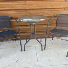 Small glass top garden table and x2 metal frame chairs