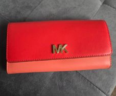 Michael Kors red and pink wallet with gold-tone MK logo. Multiple card slots and a zipped coin compartment. In perfect condition apart from some minor wear inside, which is not noticeable when using it, as shown in the photos.