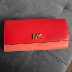 Michael Kors red and pink wallet with gold-tone MK logo. Multiple card slots and a zipped coin compartment. In perfect condition apart from some minor wear inside, which is not noticeable when using it, as shown in the photos.