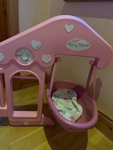 Baby doll play centre with high chair, bath and cot.