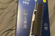 Oral b pro 1 braun electric toothbrush with travel case