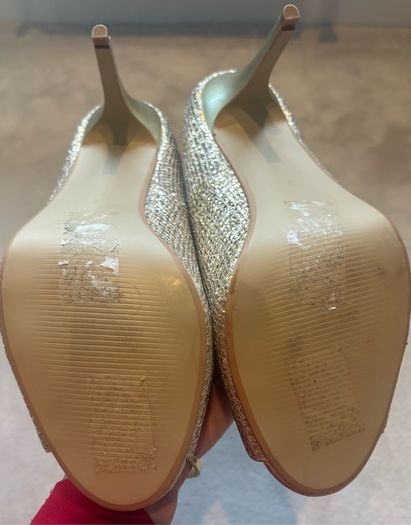 Gold glitter peep-toe heels.