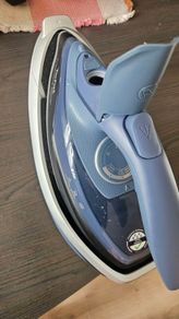 Teal steam iron