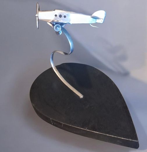1970s chrome airplane on stand