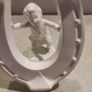 Rare find Cherub  Porcelain Horseshoe as flower vase held with child . Image 3