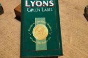 This vintage Lyons Green Label tea tin is a collectible item.