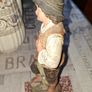 Old Painted Terracotta of a Young Country Boy Holding a Flute, standing on a rocky base. It resembles late 19th- or early 20th-century European decorative sculptures, such as pieces produced by makers like Goldscheider Image 6
