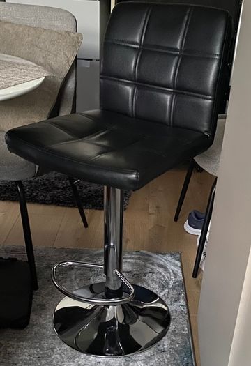 Black faux leather bar stool