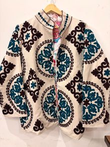 Suzani velvet jacket Beautiful embroidered floral jacket in a gorgeous white with intricate blue and black detailing.