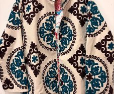 Suzani velvet jacket Beautiful embroidered floral jacket in a gorgeous white with intricate blue and black detailing.