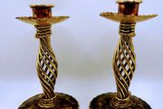 A pair of vintage spiral candle holders