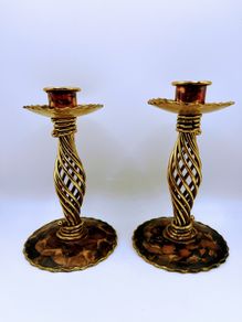 A pair of vintage brass spiral candle holders