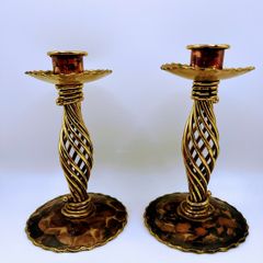 A pair of vintage brass spiral candle holders