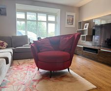 Red swivel accent chair