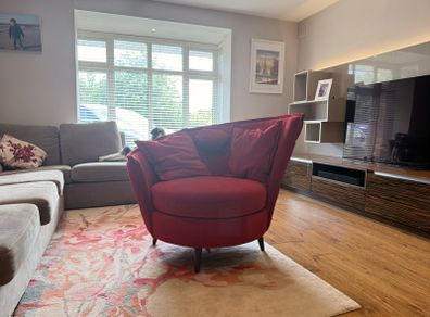 Red swivel accent chair