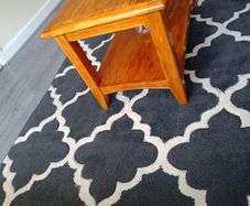 Dark grey Rug in great condition, Has been washed already and ready to go.