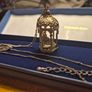 Vintage gilded bird cage with a bird pendant. Image 2