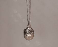 Small Sterling silver locket pendant on a silver chain