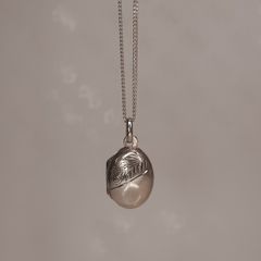Small Sterling silver locket pendant on a silver chain