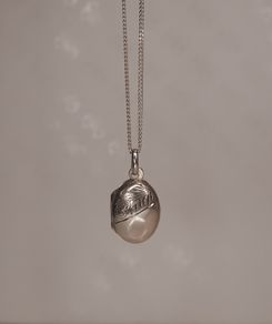 Small Sterling silver locket pendant on a silver chain