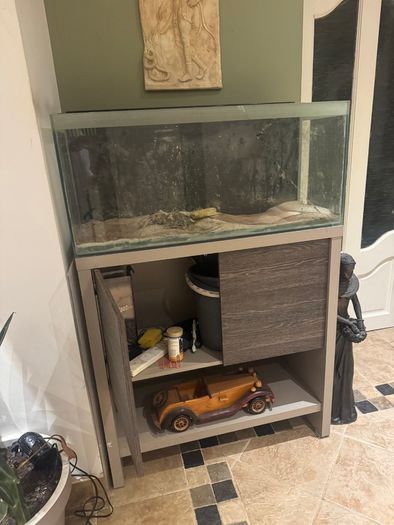 Large glass tank with matching storage cabinet stand