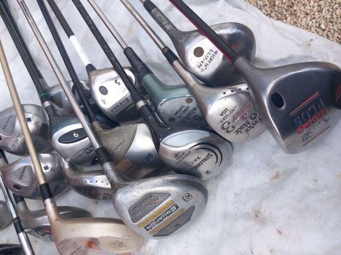 A selection of golf clubs and bags. Golf balls