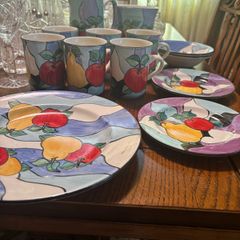 Colourful hand made pottery mugs set